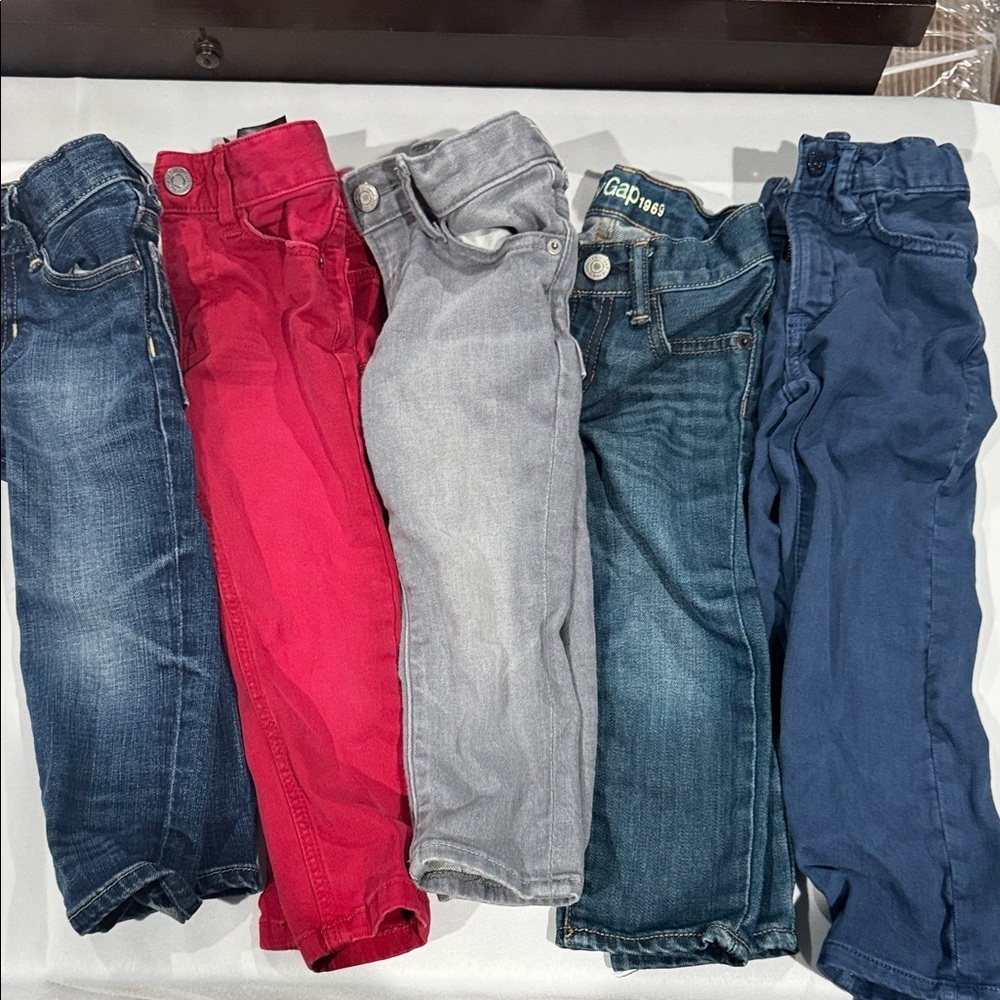 GAP Kids Jeans in Blue and Gray. One red H&M pair.